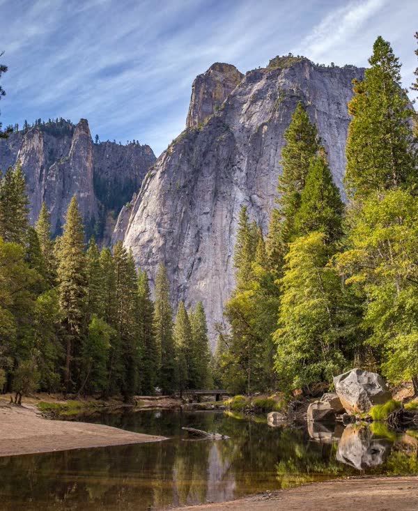A granite cliff above a forest river